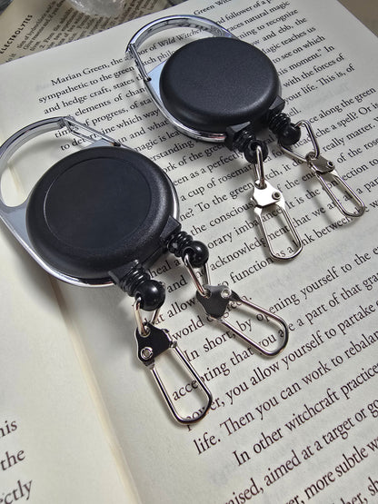 Dual-Function Retractable Badge Reel (Double-Headed) Sacred Sol Design