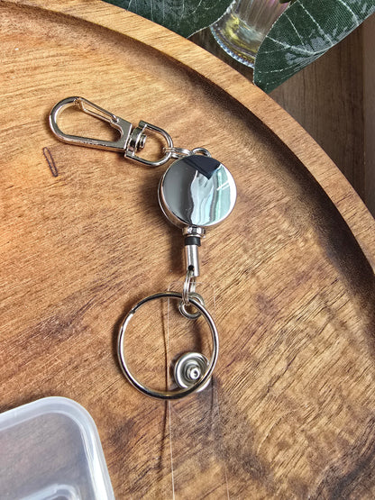 Clip-on Extendable Badge Reel Sacred Sol Design